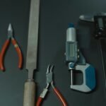 A collection of precision tools on a dark surface, ideal for craftsmanship and woodworking.