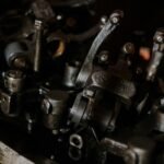 Detailed view of interconnected metal engine components showcasing mechanical intricacy.